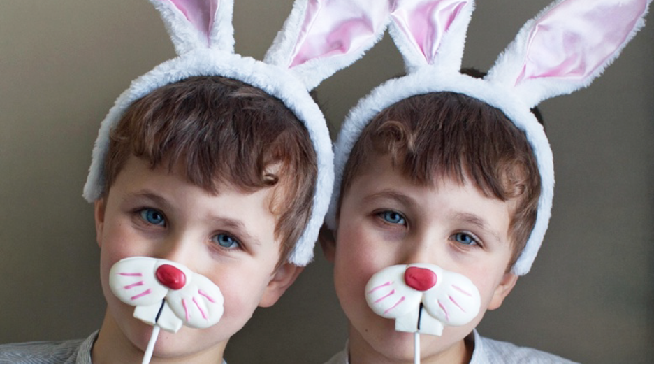 Two boys model their homemade bunny masks. Bunnies need a variety of nutrients and textures in their meals just like us so they can maintain their oral and overall health.