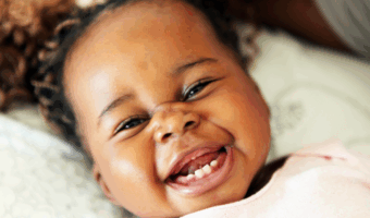 Baby laughing and smiling.