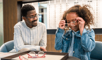 Kid getting fitted for glasses at the eye doctor.