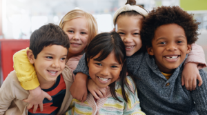 Group of children smiling together.