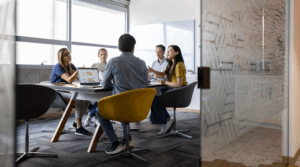Group of people discussing insurance.