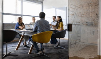 Group of people discussing insurance.