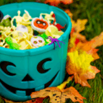 Bucket of halloween candy and toys.