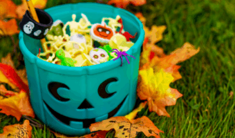 Bucket of halloween candy and toys.
