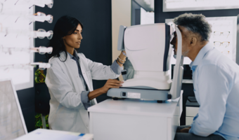 Eye doctor giving a patient an eye exam.