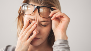 Person rubbing their eyes.