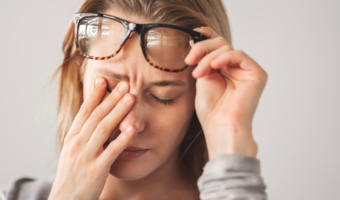 Person rubbing their eyes.